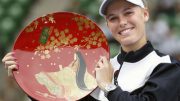 Wozniacki eyes top after retaining Tokyo title